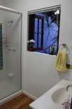 The quaint double window &hellip;
opens high over the indoor garden and the waterfall 