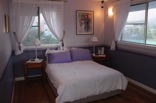 Bedroom no 2 on the 2nd floor has 2 large windows, plenty of space and built in cupboards 